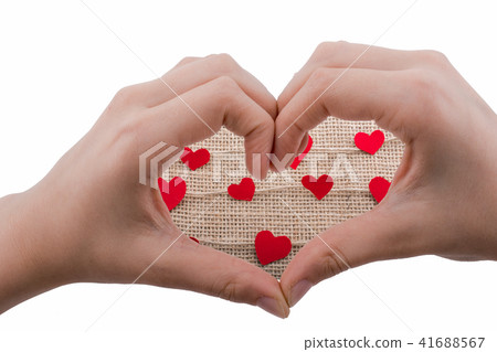 Heart shapes behind a heart shaped hand 41688567