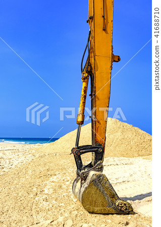 Yellow excavator at beach Yellow excavator at beach 41688710