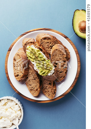 Fresh french chopped baguette and avocado. Fresh french chopped baguette and avocado. 41689379