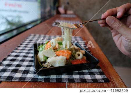 Thai salad sour & spicy seafood with tomato Thai salad sour & spicy seafood with tomato 41692799