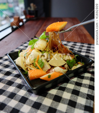 Thai salad sour & spicy seafood noodle celery pork 41692809