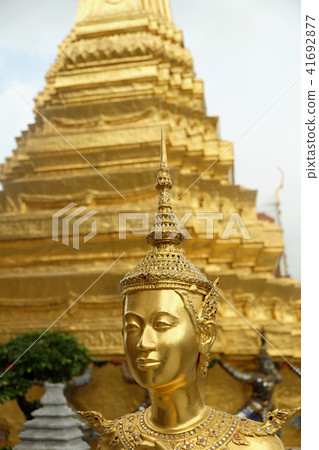 Golden Kinnari statue at Temple of Emerald Buddha 41692877