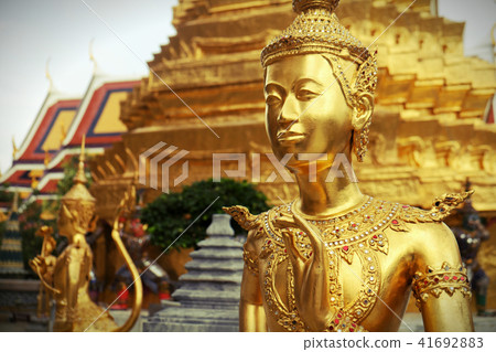 Golden Kinnari statue at Temple of Emerald Buddha 41692883