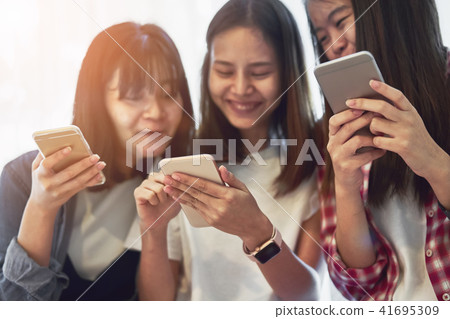 Woman using smartphone for the application. 41695309