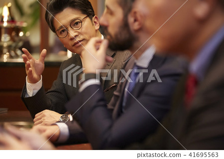 A businessman drinking at a bar A businessman drinking at a bar 41695563