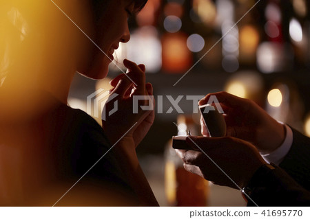 Men and women drinking at the bar 41695770