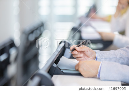 Businessman undergoing qualification exam Hand part Seminar qualification examination office casual business scene 41697005