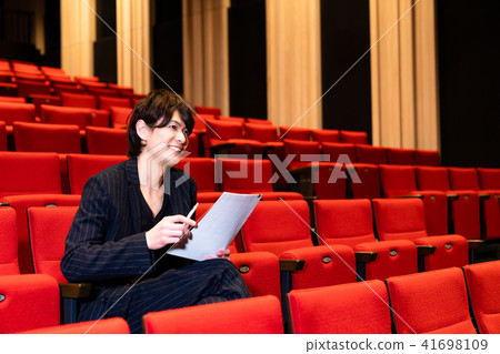 Men in the audience seats 41698109
