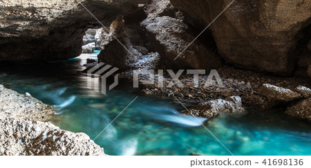 Panorama of the underground lake in a cave of bright blue color Panorama of the underground lake in a cave of bright blue color 41698136
