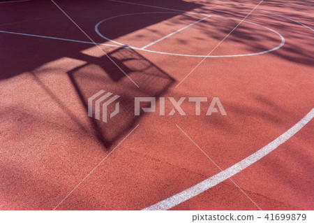 Shadow on the court of basketball basket with chains on streetball court 41699879