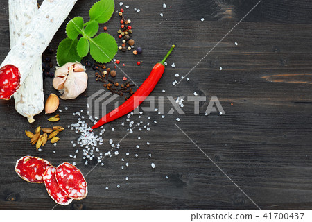 Sliced cured sausage, meat  with spices. 41700437