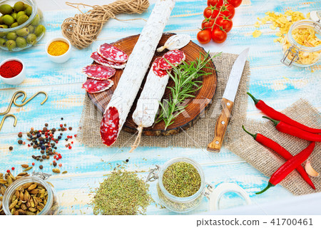 Sliced cured sausage, meat  with spices. 41700461