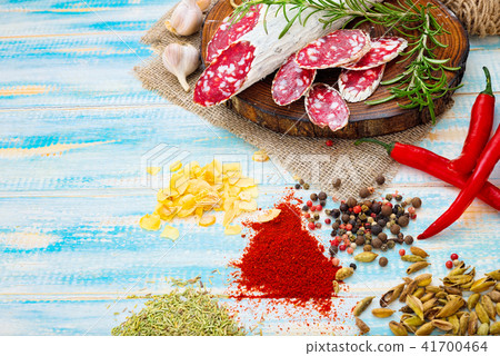 Sliced cured sausage, meat  with spices. 41700464