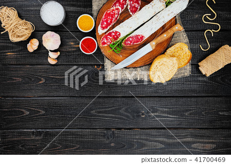 Sliced cured sausage, meat  with spices. 41700469