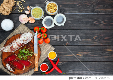 Sliced cured sausage, meat  with spices. 41700480