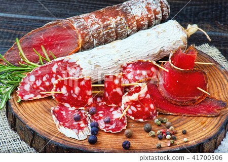 Sliced cured sausage, meat with spices. Sliced cured sausage, meat with spices. 41700506