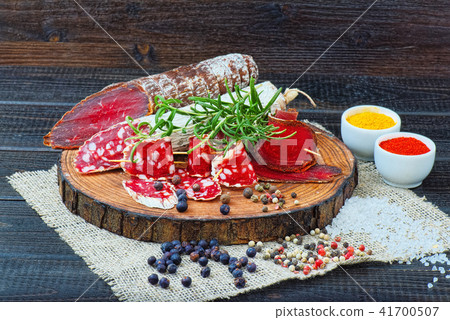 Sliced cured sausage, meat  with spices. 41700507
