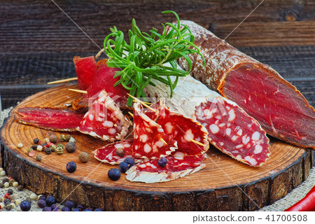 Sliced cured sausage, meat  with spices. 41700508