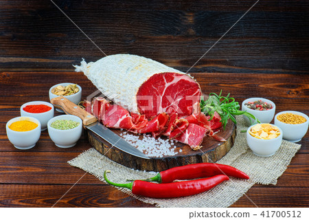 Sliced cured sausage, meat  with spices. 41700512