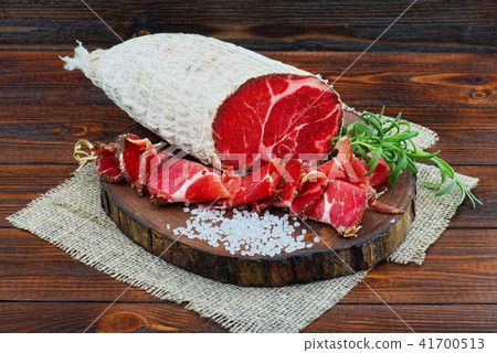 Sliced cured sausage, meat with spices. Sliced cured sausage, meat with spices. 41700513