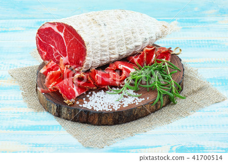 Sliced cured sausage, meat with spices. Sliced cured sausage, meat with spices. 41700514