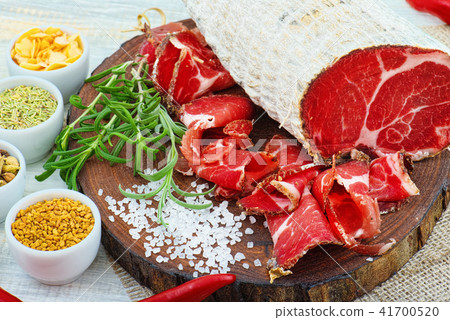 Sliced cured sausage, meat  with spices. 41700520