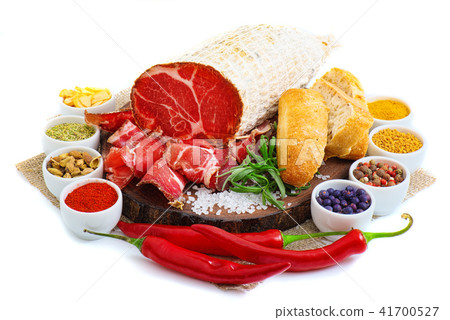 Sliced cured sausage, meat with spices. Sliced cured sausage, meat with spices. 41700527