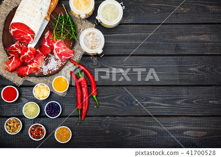 Sliced cured sausage, meat with spices. Sliced cured sausage, meat with spices. 41700528