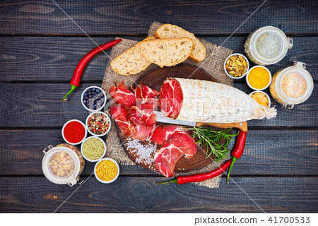 Sliced cured sausage, meat with spices. Sliced cured sausage, meat with spices. 41700533