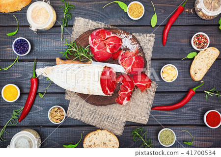 Sliced cured sausage, meat  with spices. 41700534