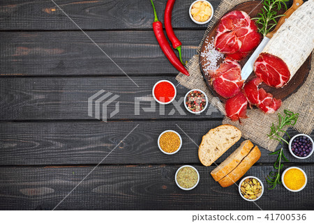 Sliced cured sausage, meat  with spices. 41700536