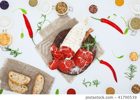 Sliced cured sausage, meat  with spices. 41700539