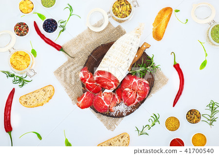 Sliced cured sausage, meat  with spices. 41700540