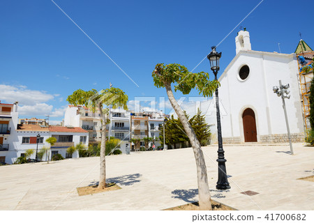 The church is in Sitges town and trees, Spain 41700682