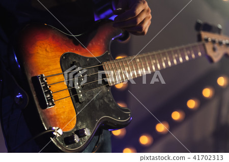 Bass guitar in guitarist hands 41702313