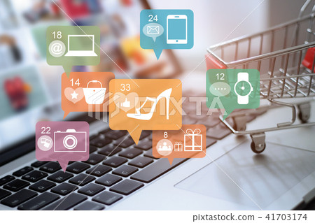 Laptop and cart with icon online shopping network Laptop and cart with icon online shopping network 41703174