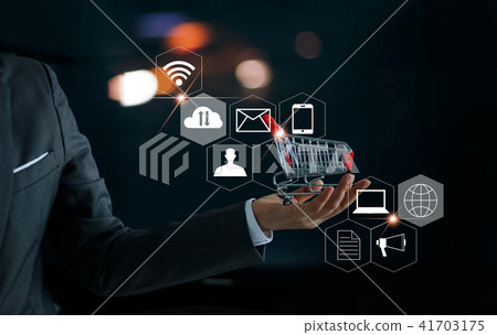 Businessman with small shopping cart in hand 41703175