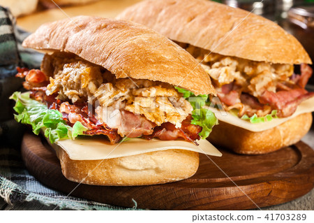 Ciabatta sandwich with smoked bacon and eggs Ciabatta sandwich with smoked bacon and eggs 41703289