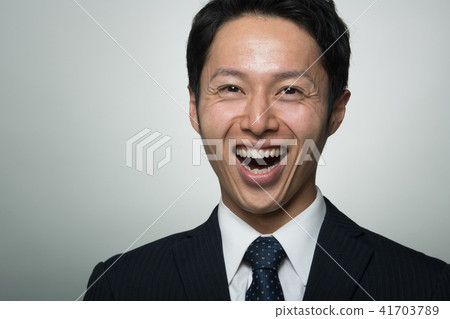 A Young Businessman Laughing Japanese Men Stock Photo 41703789 Pixta