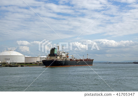 Ship handling cargo at a petroleum complex 41705347
