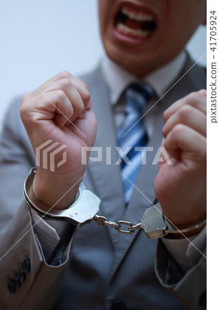 Arrest (failure criminal criminal face none suit business business work handcuffs regrettable copy space male person) 41705924