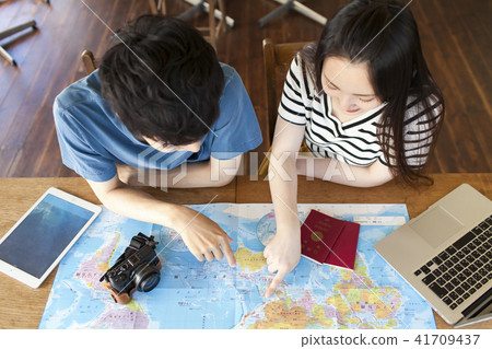 Young couple planning overseas trips 41709437