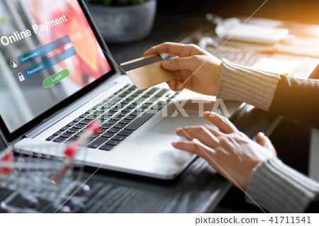 Woman using laptop for online payment internet Woman using laptop for online payment internet 41711541