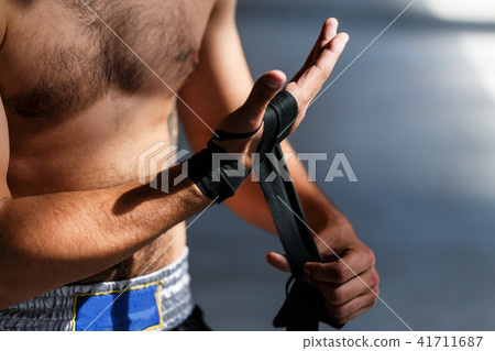 Boxer Makes Bandages on Fists Boxer Makes Bandages on Fists 41711687