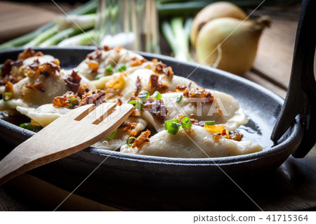 Dumplings with meat, onion and bacon. Dumplings with meat, onion and bacon. 41715364