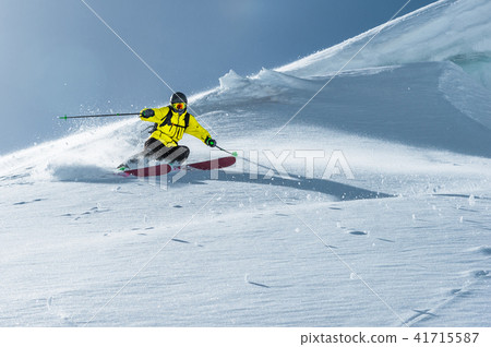 The total length of skiing on fresh snow powder. Professional skier outside the track on a sunny day 41715587