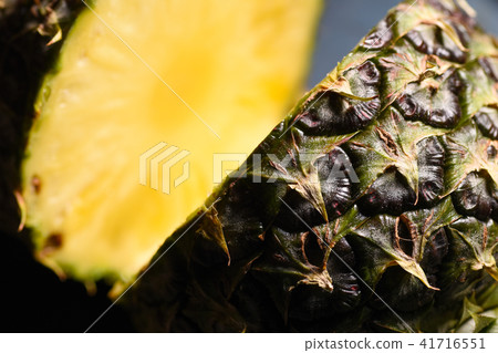 Close-up juicy cut pineapple on the kitchen table Close-up juicy cut pineapple on the kitchen table 41716551
