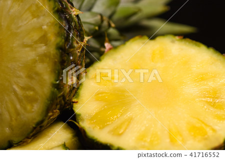Close-up juicy cut pineapple on the kitchen table Close-up juicy cut pineapple on the kitchen table 41716552