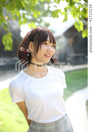 Portrait beautiful asian girl looking and smile in nature leaves outdoor Portrait beautiful asian girl looking and smile in nature leaves outdoor 41723218