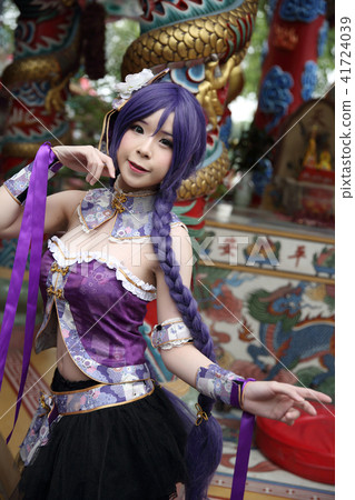 Portrait of asian young woman dancing with purple Chinese dress cosplay with temple 41724039